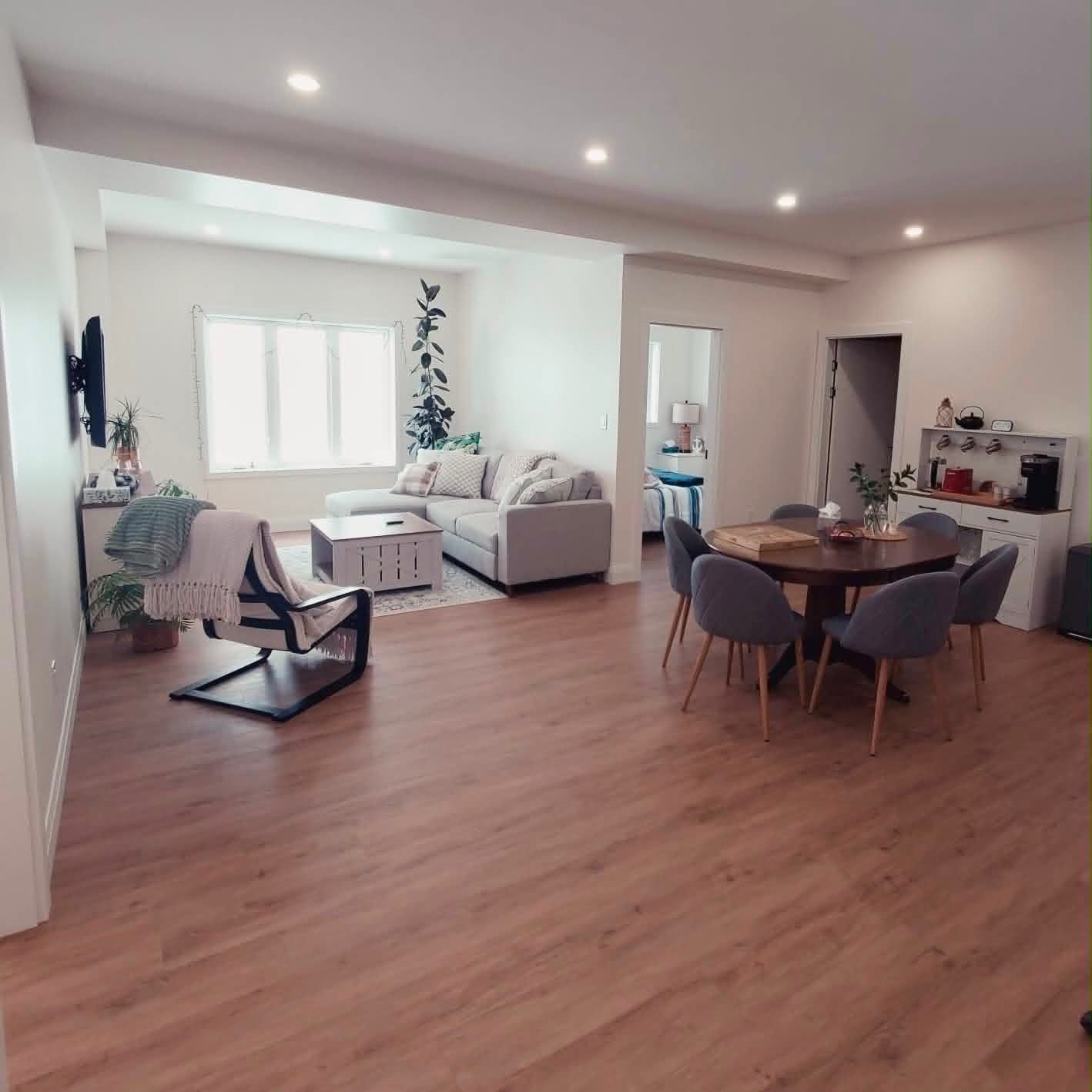 Finished basement living and dining area by ARK Renovation