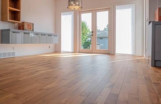 Light oak hardwood flooring installed by ARK Renovation