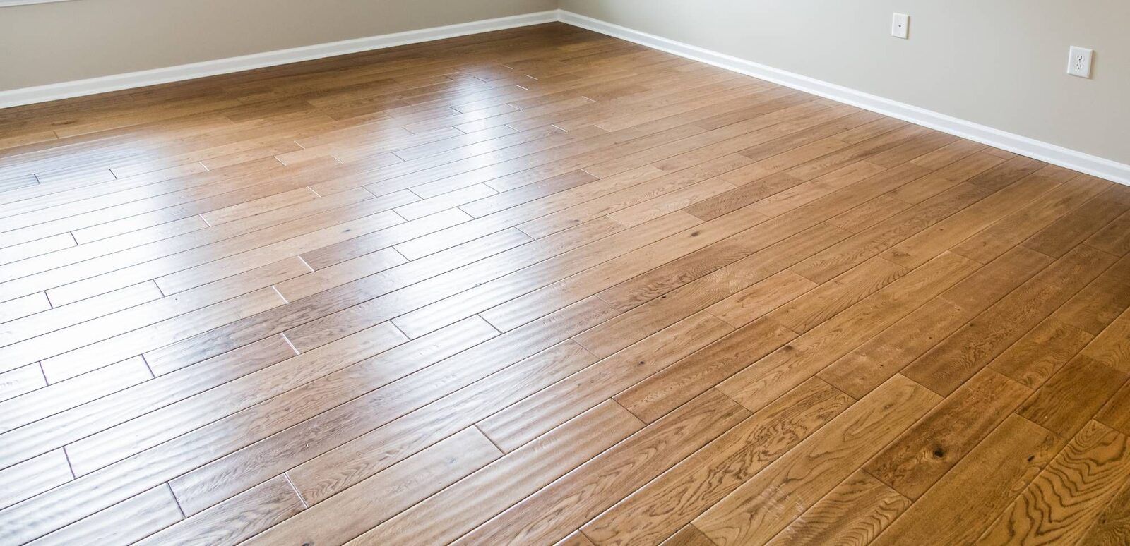 Close-up detail of a hardwood floor refinish by ARK Renovation